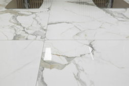 a-pair-of-chairs-sitting-on-top-of-a-marble-floor.jpg a pair of chairs sitting on top of a marble floor