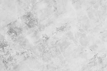 a black and white photo of a marble surface