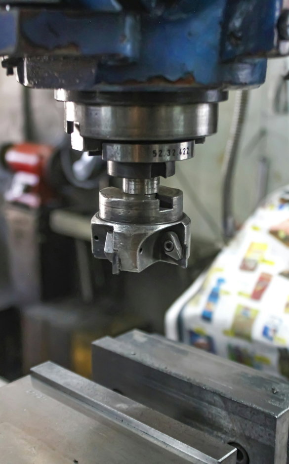 A machine that is working on a piece of metal